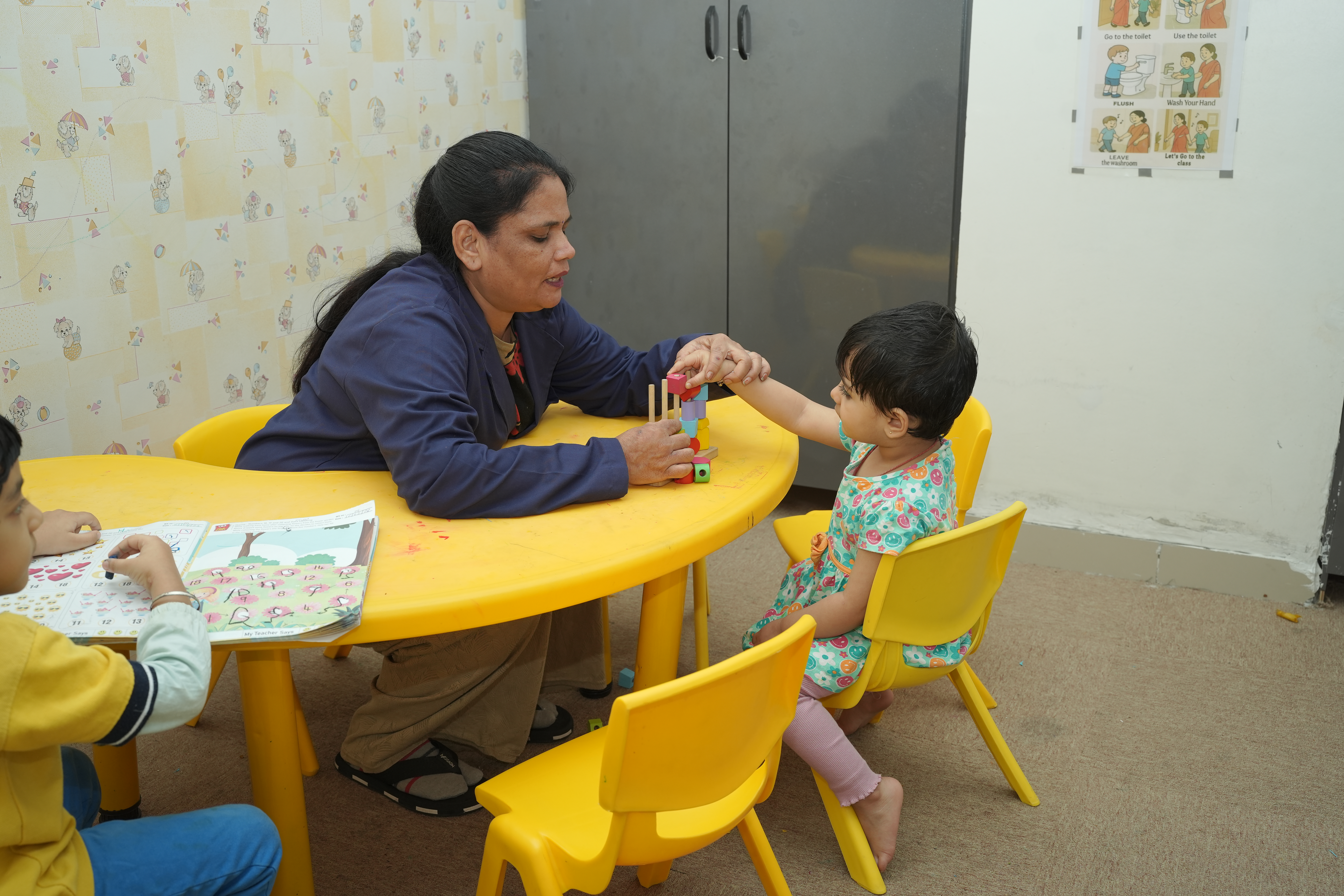 Child receiving speech therapy from a professional therapist
